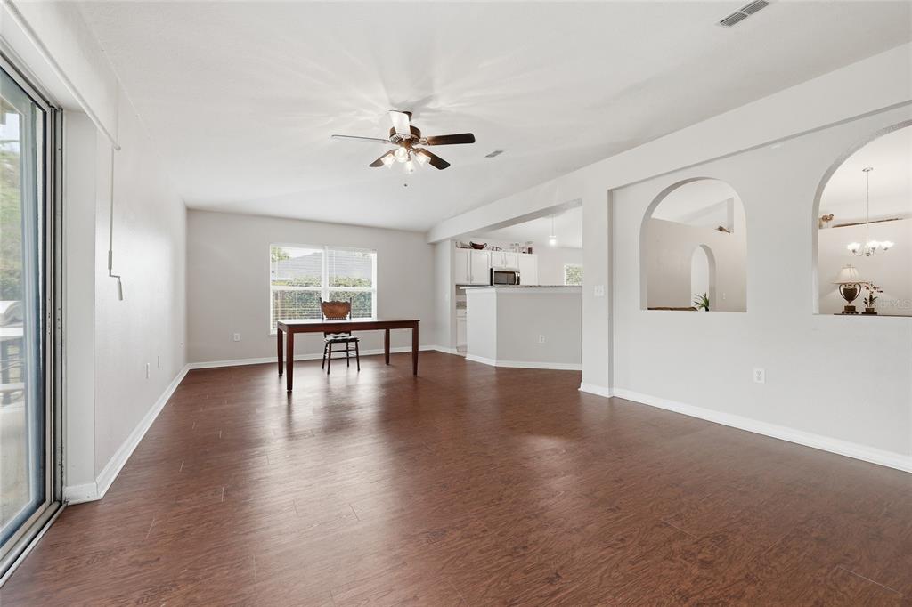 23152 Northwest 11th Road Newberry, FL 32669 - Photo 15 of 31 a view of an empty room with a window and wooden floor
