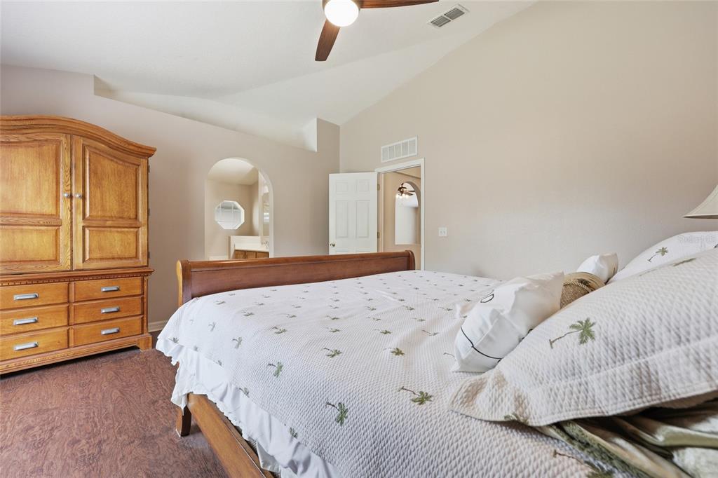 23152 Northwest 11th Road Newberry, FL 32669 - Photo 17 of 31 a bedroom with a bed and a dresser