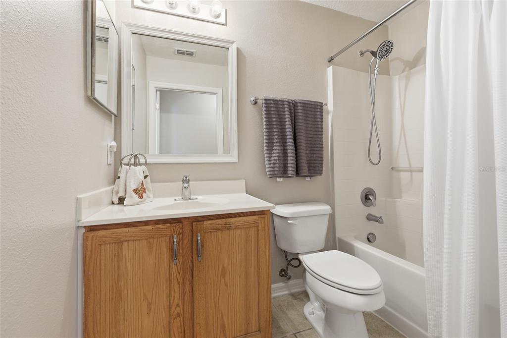 23152 Northwest 11th Road Newberry, FL 32669 - Photo 22 of 31 a bathroom with a sink toilet and shower