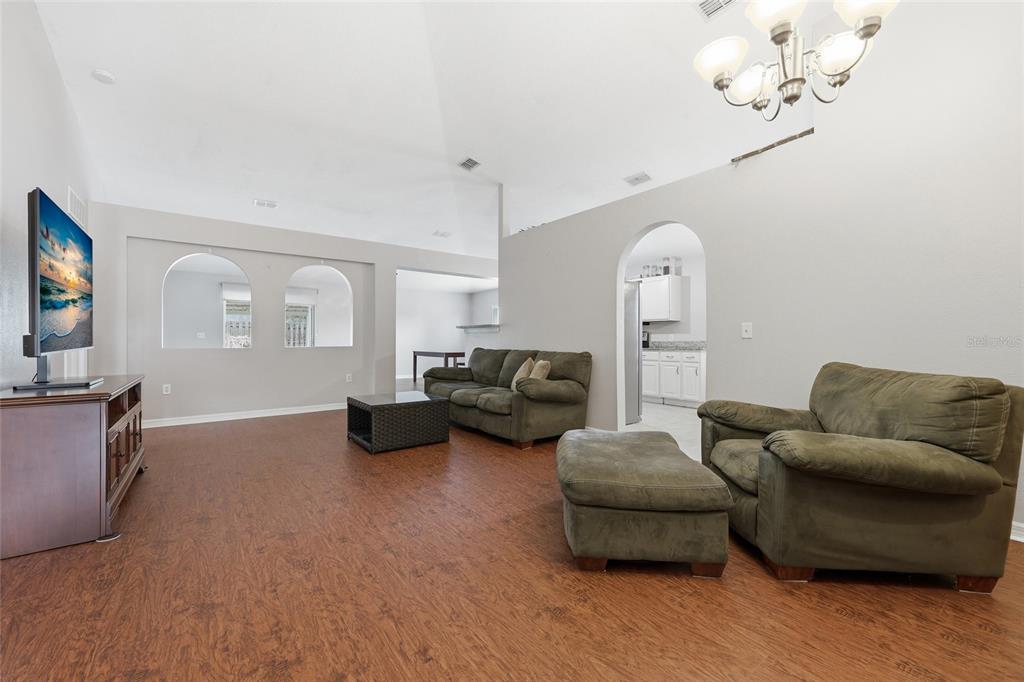 23152 Northwest 11th Road Newberry, FL 32669 - Photo 5 of 31 a living room with furniture and a flat screen tv