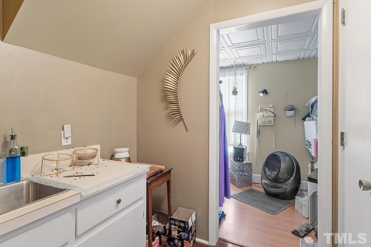 324 Cutler Street Raleigh, NC 27603 - Photo 15 of 34 a bathroom with a sink a toilet and shower
