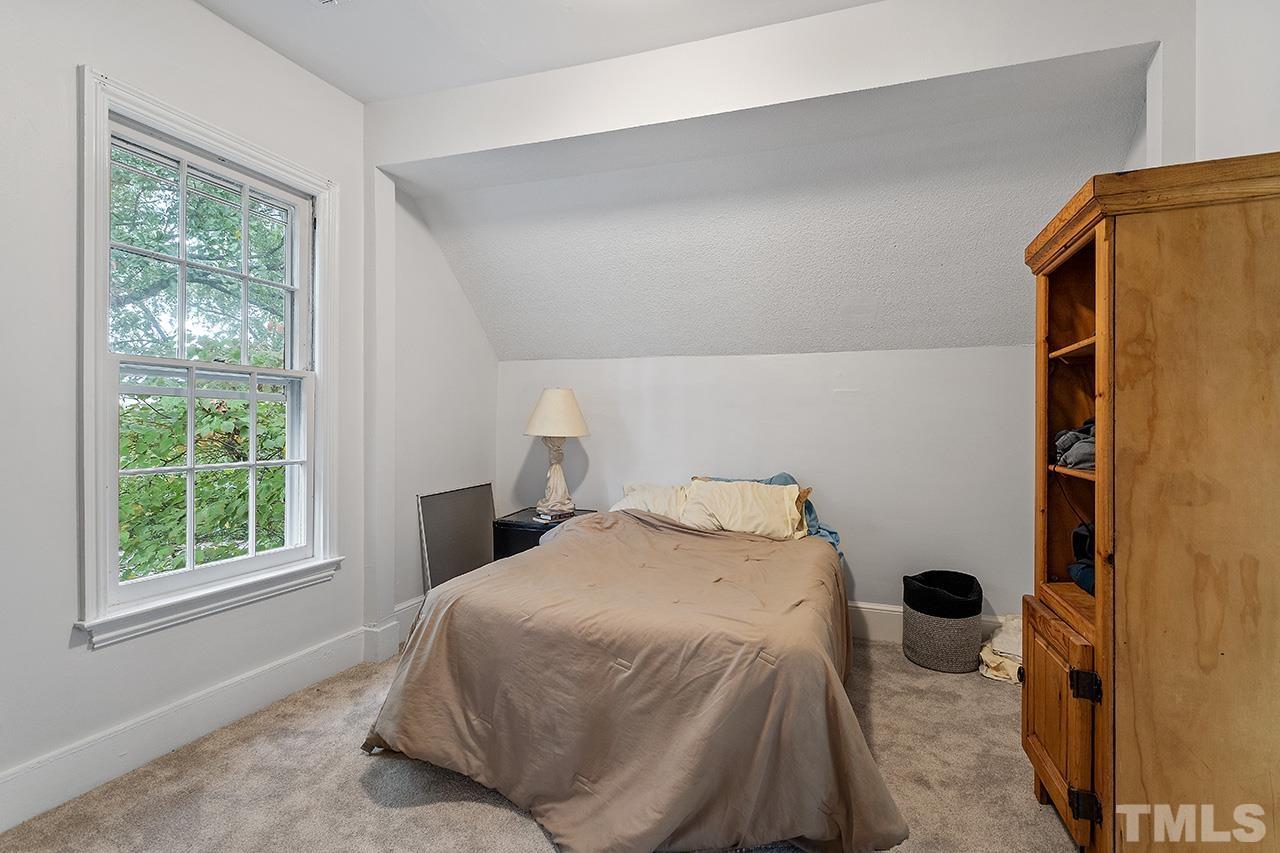 324 Cutler Street Raleigh, NC 27603 - Photo 31 of 34 a bedroom with a bed and a window