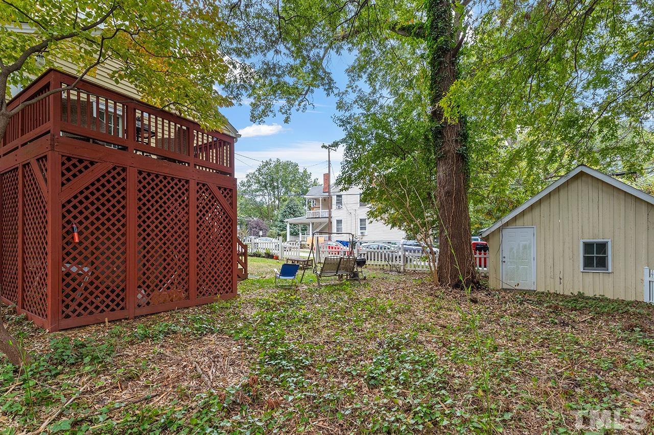 324 Cutler Street Raleigh, NC 27603 - Photo 4 of 34 a view of a house with a yard