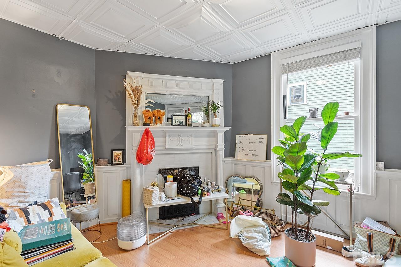 324 Cutler Street Raleigh, NC 27603 - Photo 6 of 34 a living room filled with furniture and a potted plant