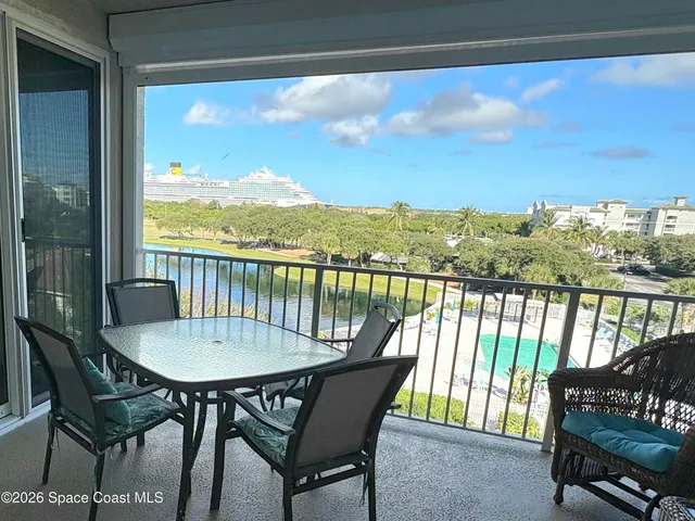 a view of a chairs and table in patio