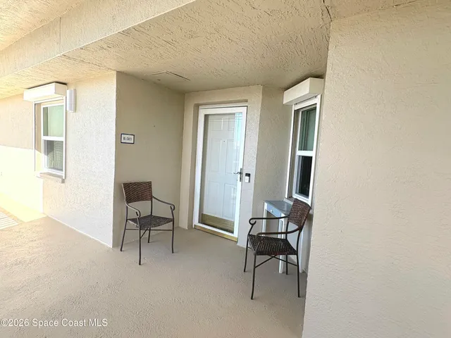 a view of a livingroom with furniture and a window