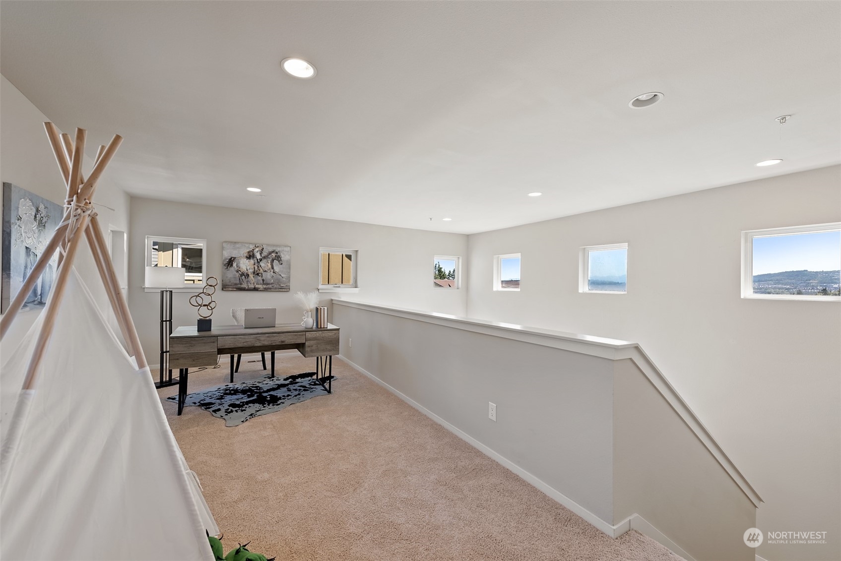 82 Cougar Ridge Road Northwest Issaquah, WA 98027 - Photo 15 of 31 a view of a room with wooden floor and furniture