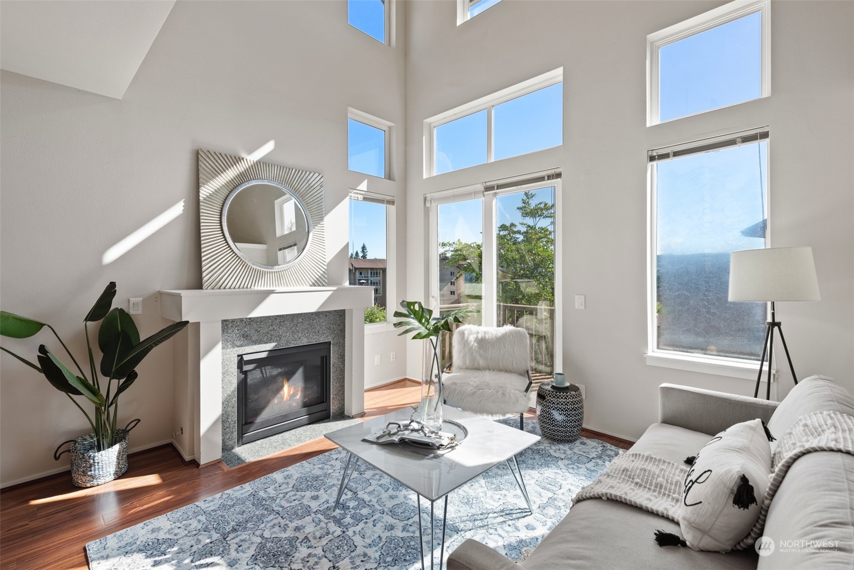 82 Cougar Ridge Road Northwest Issaquah, WA 98027 - Photo 2 of 31 a living room with furniture a window and a fireplace