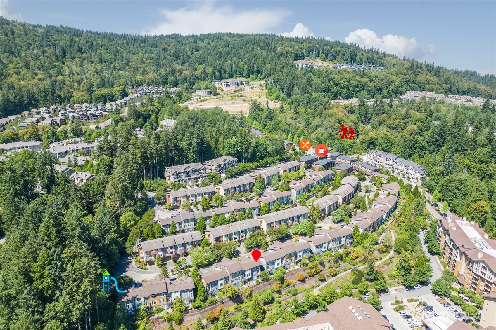 82 Cougar Ridge Road Northwest Issaquah, WA 98027 - Photo 30 of 31 a view of a large building with a lush green forest