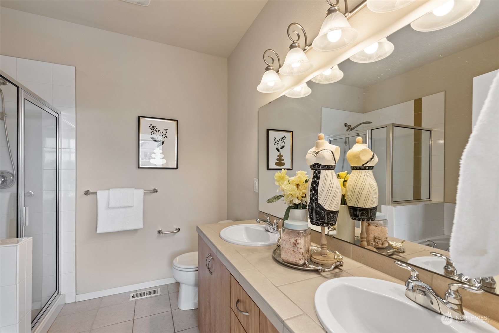 82 Cougar Ridge Road Northwest Issaquah, WA 98027 - Photo 10 of 31 a bathroom with a granite countertop toilet sink and mirror