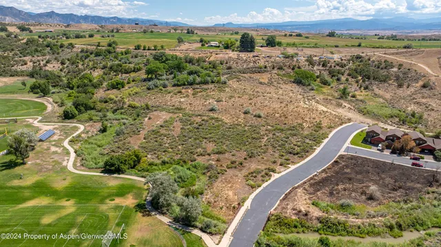 a view of a outdoor space with a lake and mountain view