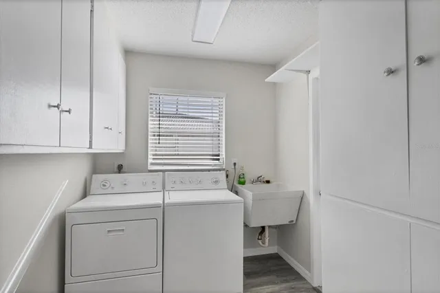 a room with a sink and cabinets