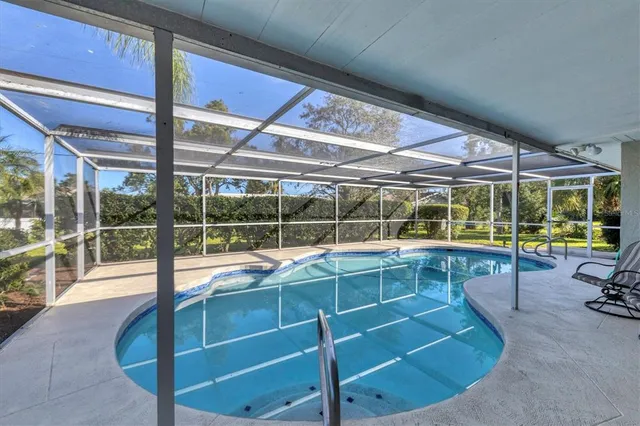 a view of a swimming pool with a porch