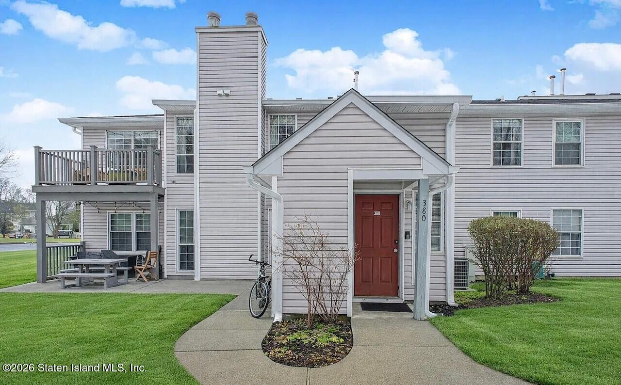 380 Hampton Place Morganville, NJ 07751 - Photo 1 of 1 a front view of a house with garden