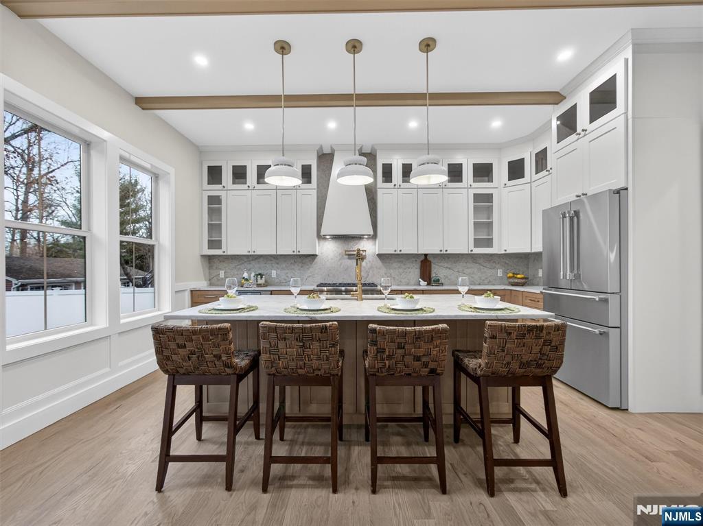 61 Beech Street Ramsey, NJ 07446 - Photo 12 of 41 a kitchen with a table and chairs in it