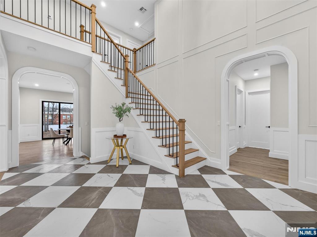 61 Beech Street Ramsey, NJ 07446 - Photo 2 of 41 a view of a hallway with a black and white checkered floor