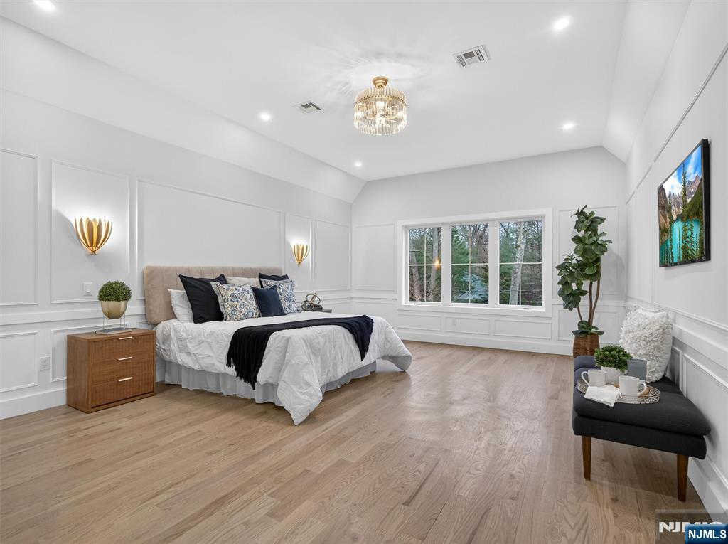 61 Beech Street Ramsey, NJ 07446 - Photo 21 of 41 a spacious bedroom with a bed and glass window