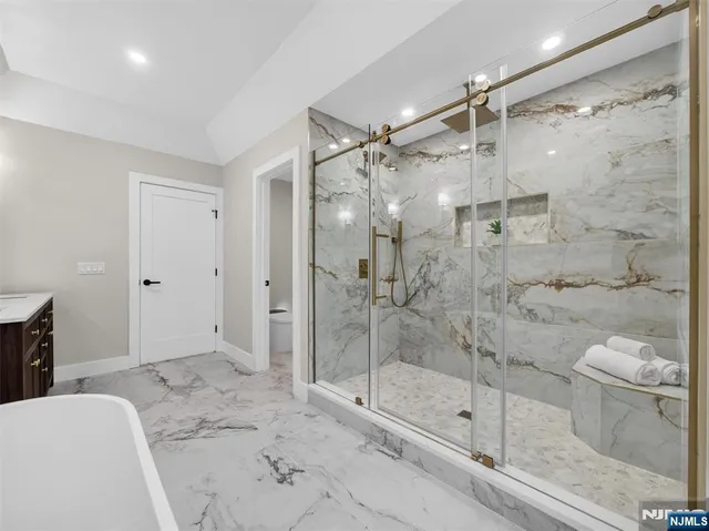 a bathroom with a shower and a toilet