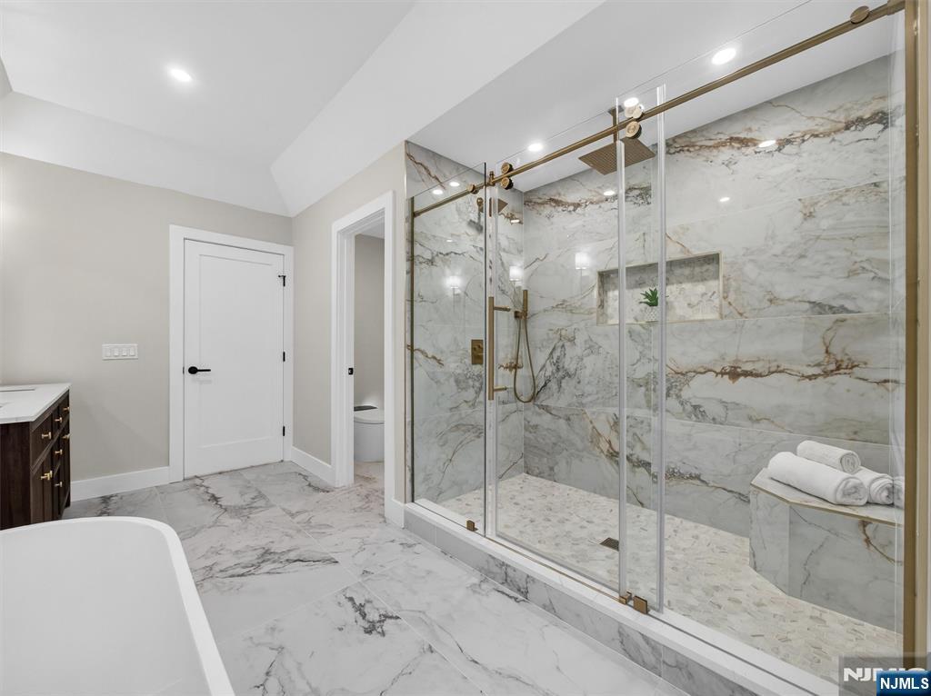 61 Beech Street Ramsey, NJ 07446 - Photo 24 of 41 a bathroom with a shower and a toilet