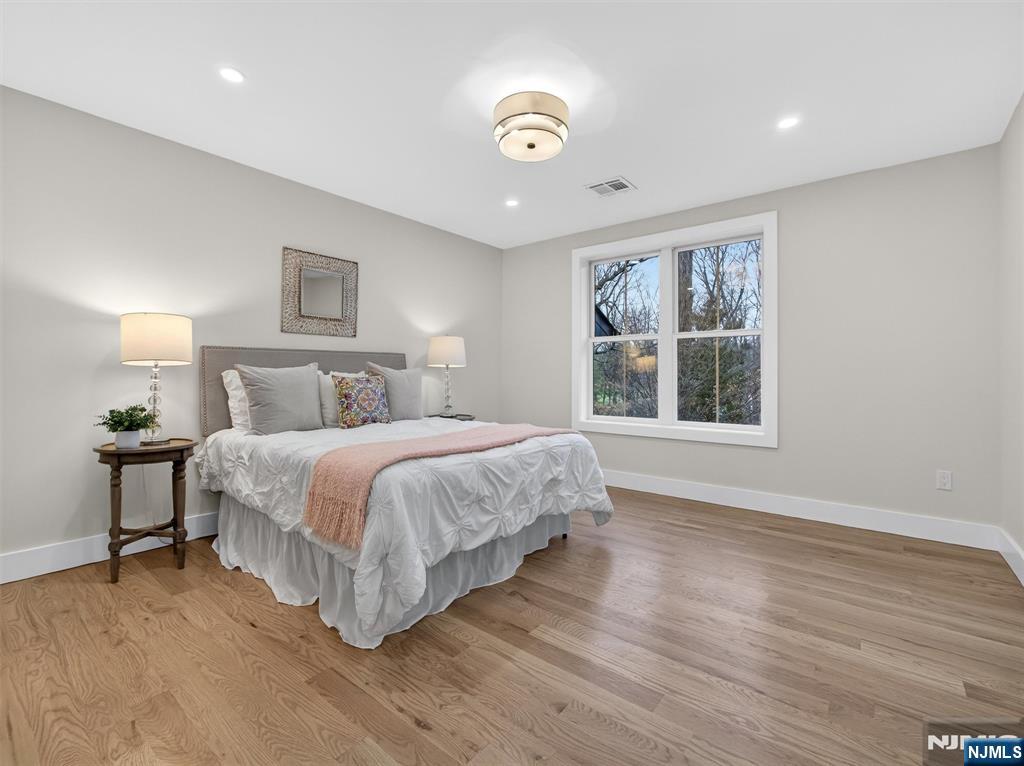 61 Beech Street Ramsey, NJ 07446 - Photo 26 of 41 a bedroom with a large bed and a window