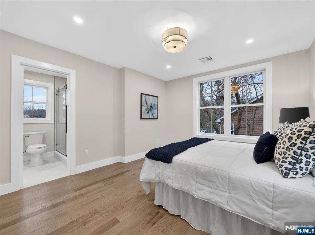 61 Beech Street Ramsey, NJ 07446 - Photo 29 of 41 a bedroom with a large bed and a window