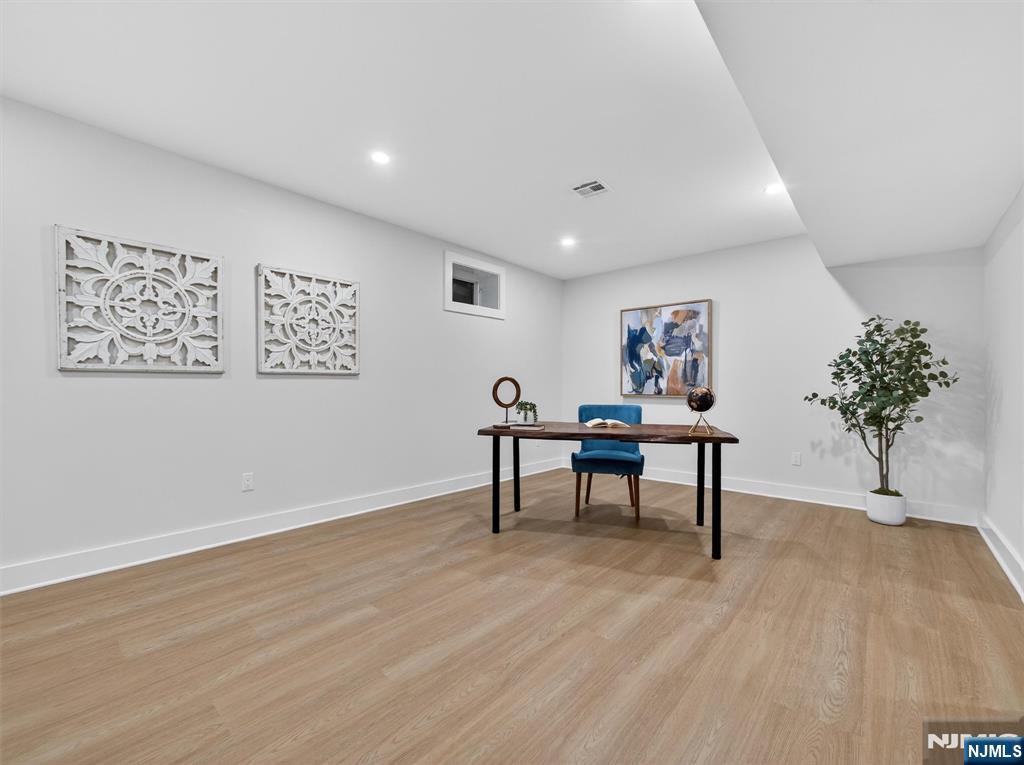 61 Beech Street Ramsey, NJ 07446 - Photo 35 of 41 a view of a workspace with furniture and a potted plant