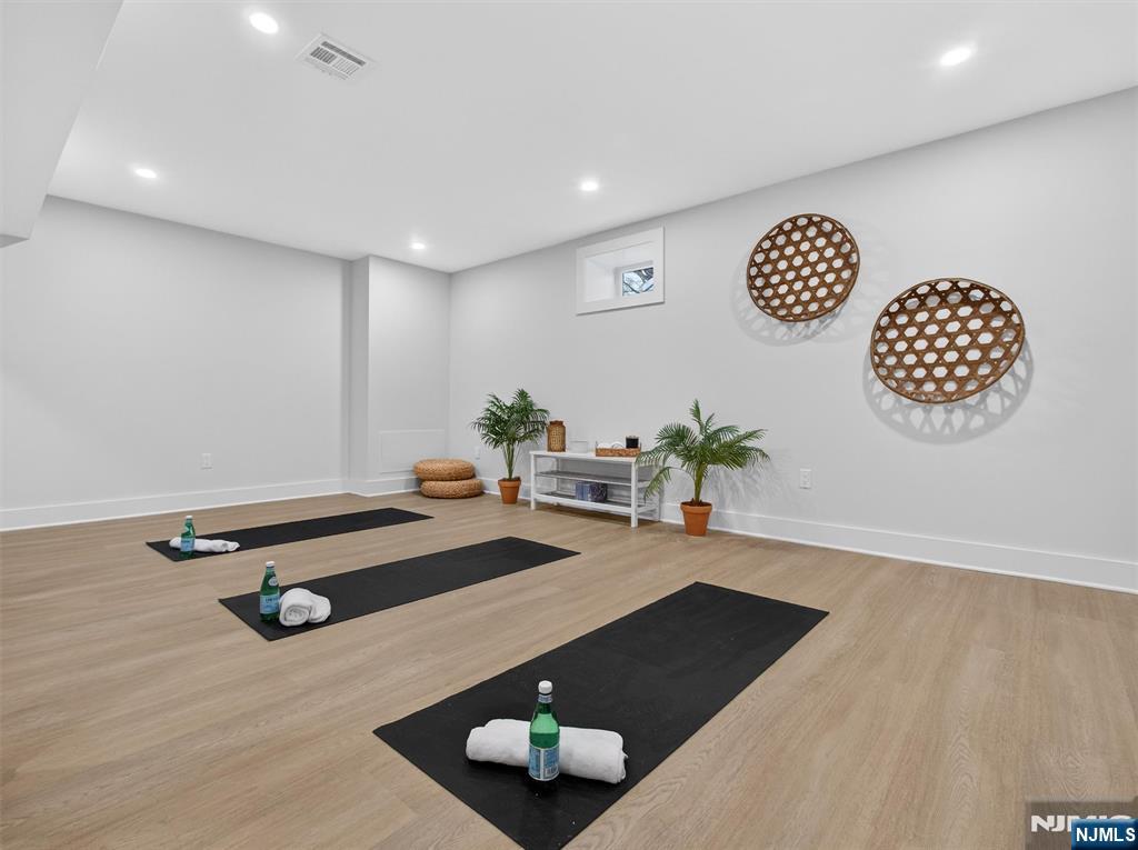 61 Beech Street Ramsey, NJ 07446 - Photo 36 of 41 a room with furniture and wooden floor