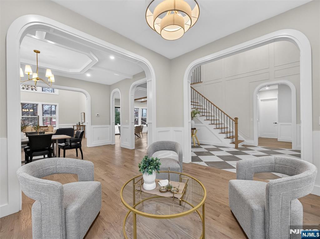 61 Beech Street Ramsey, NJ 07446 - Photo 4 of 41 a living room with fireplace furniture and a chandelier