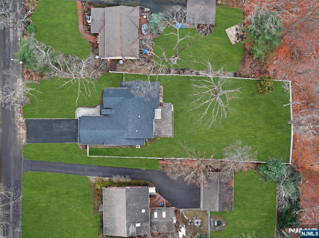 61 Beech Street Ramsey, NJ 07446 - Photo 41 of 41 an aerial view of a house with a garden and a yard