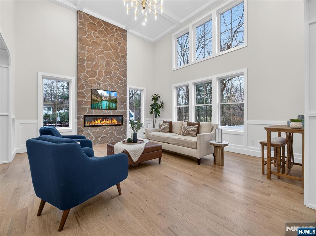 61 Beech Street Ramsey, NJ 07446 - Photo 8 of 41 a living room with furniture and a fireplace