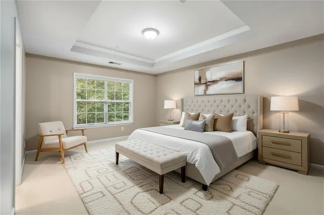 a bedroom with a bed and a lamp