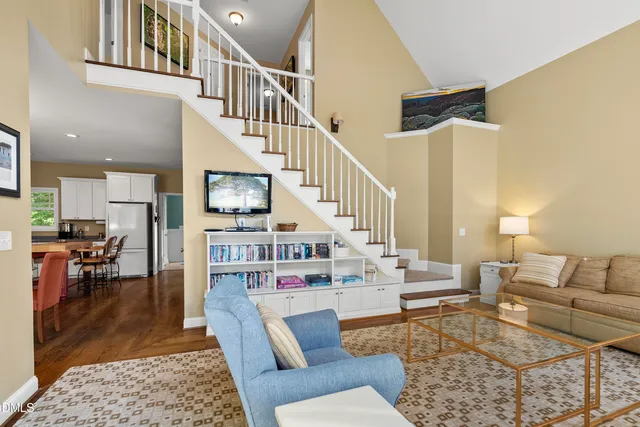 a kitchen with a sink a stove and cabinets