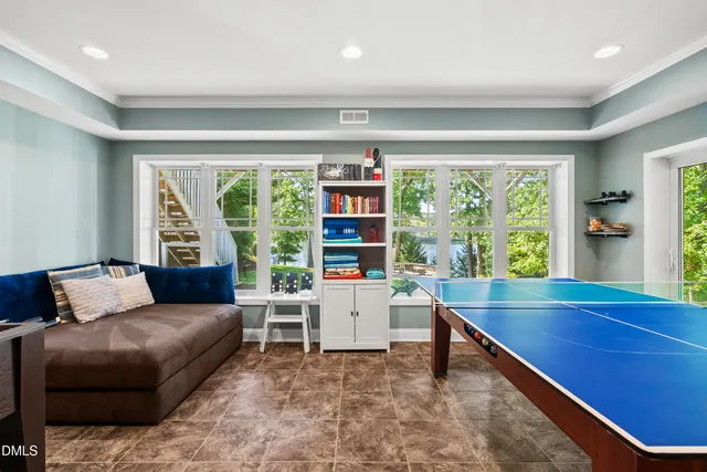 a living room with furniture wooden floor and a table