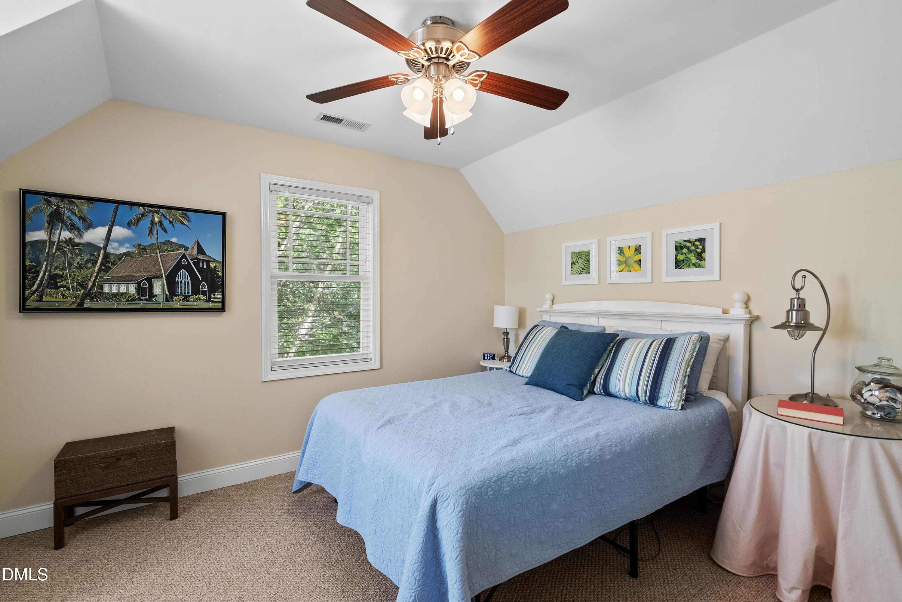 214 Crystal Bay Lane Semora, NC 27343 - Photo 22 of 37 a bedroom with a bed and a chandelier