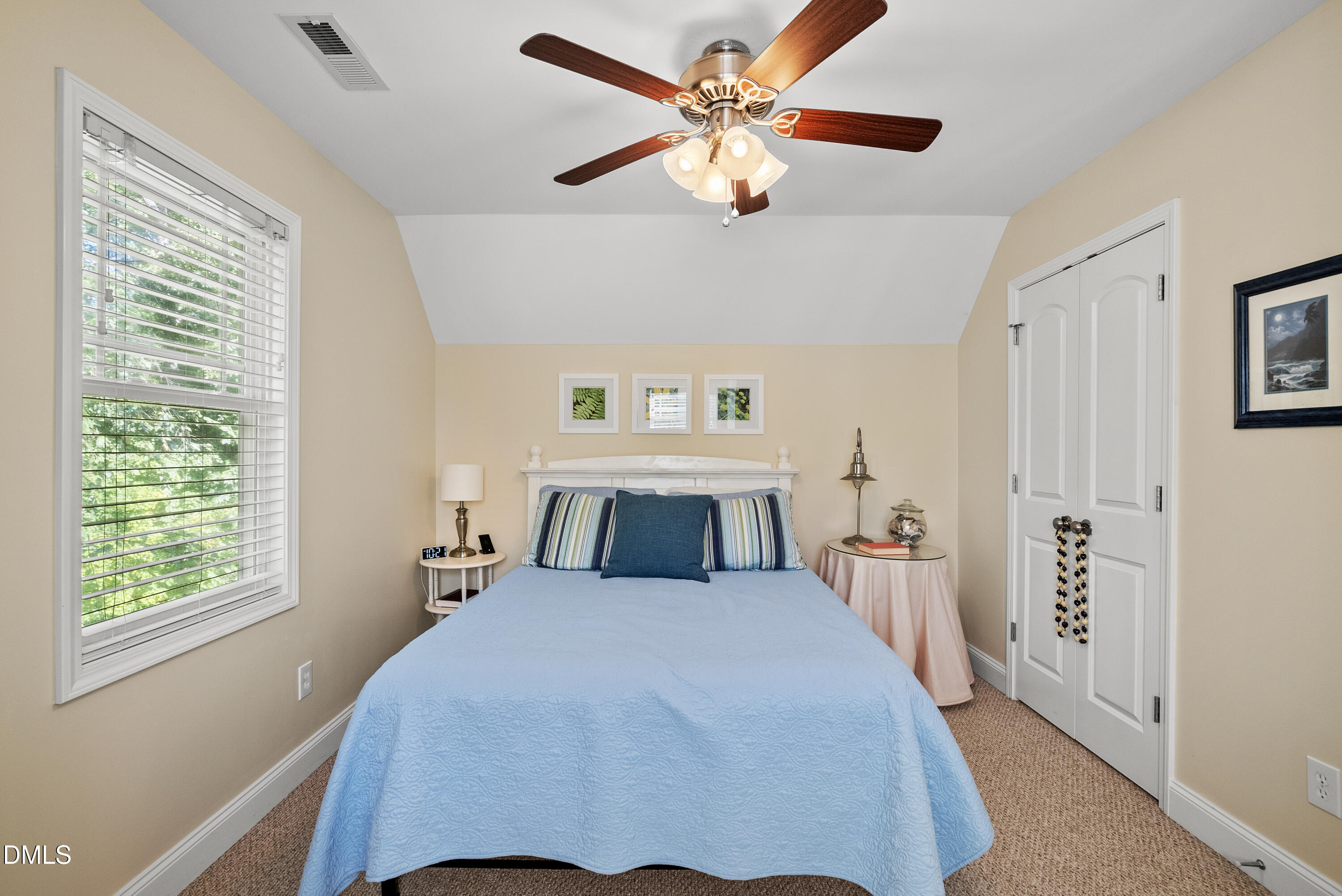 214 Crystal Bay Lane Semora, NC 27343 - Photo 23 of 37 a bedroom with a large bed and a chandelier