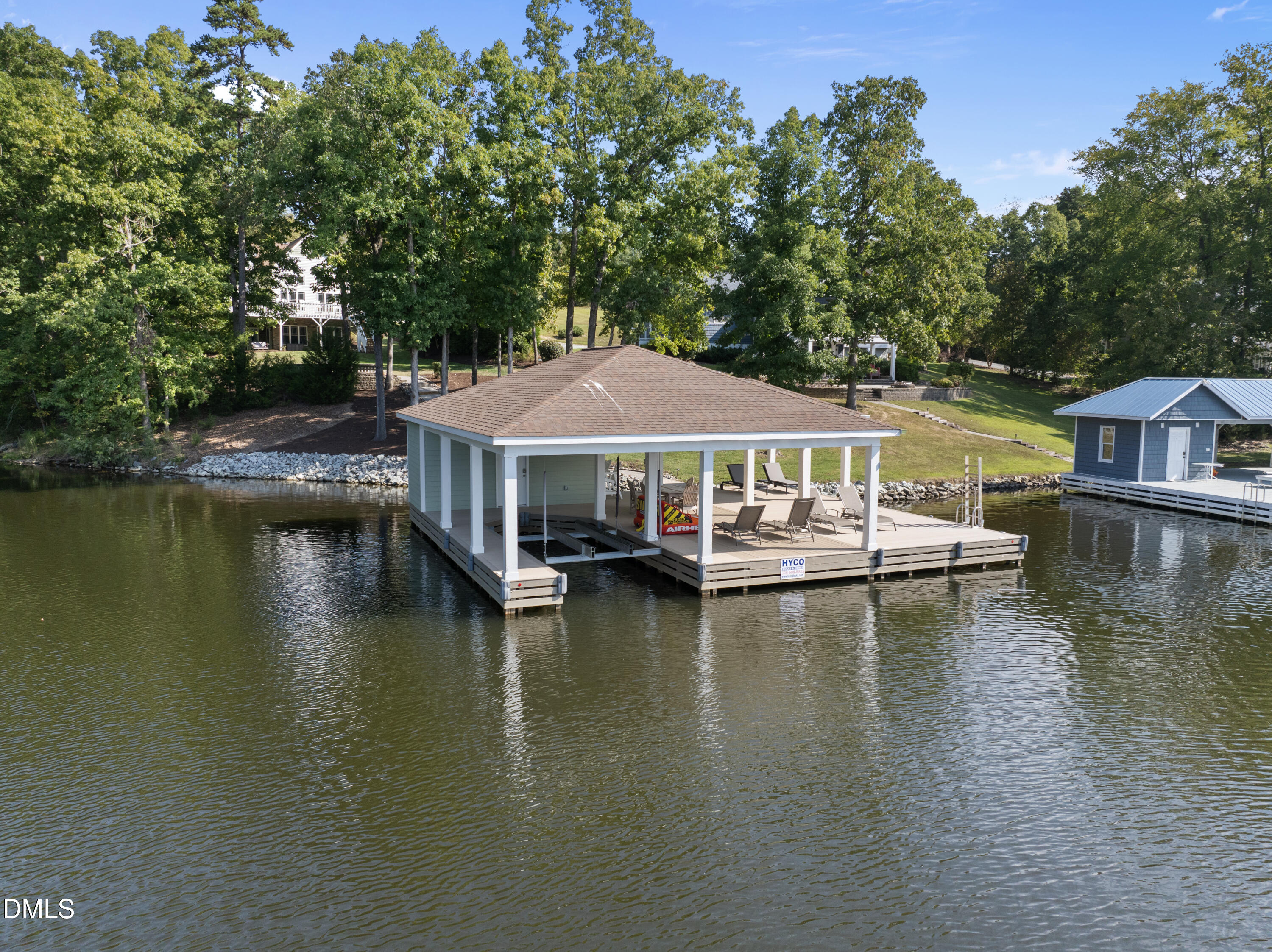 214 Crystal Bay Lane Semora, NC 27343 - Photo 26 of 37 an aerial view of a house with swimming pool patio and lake view