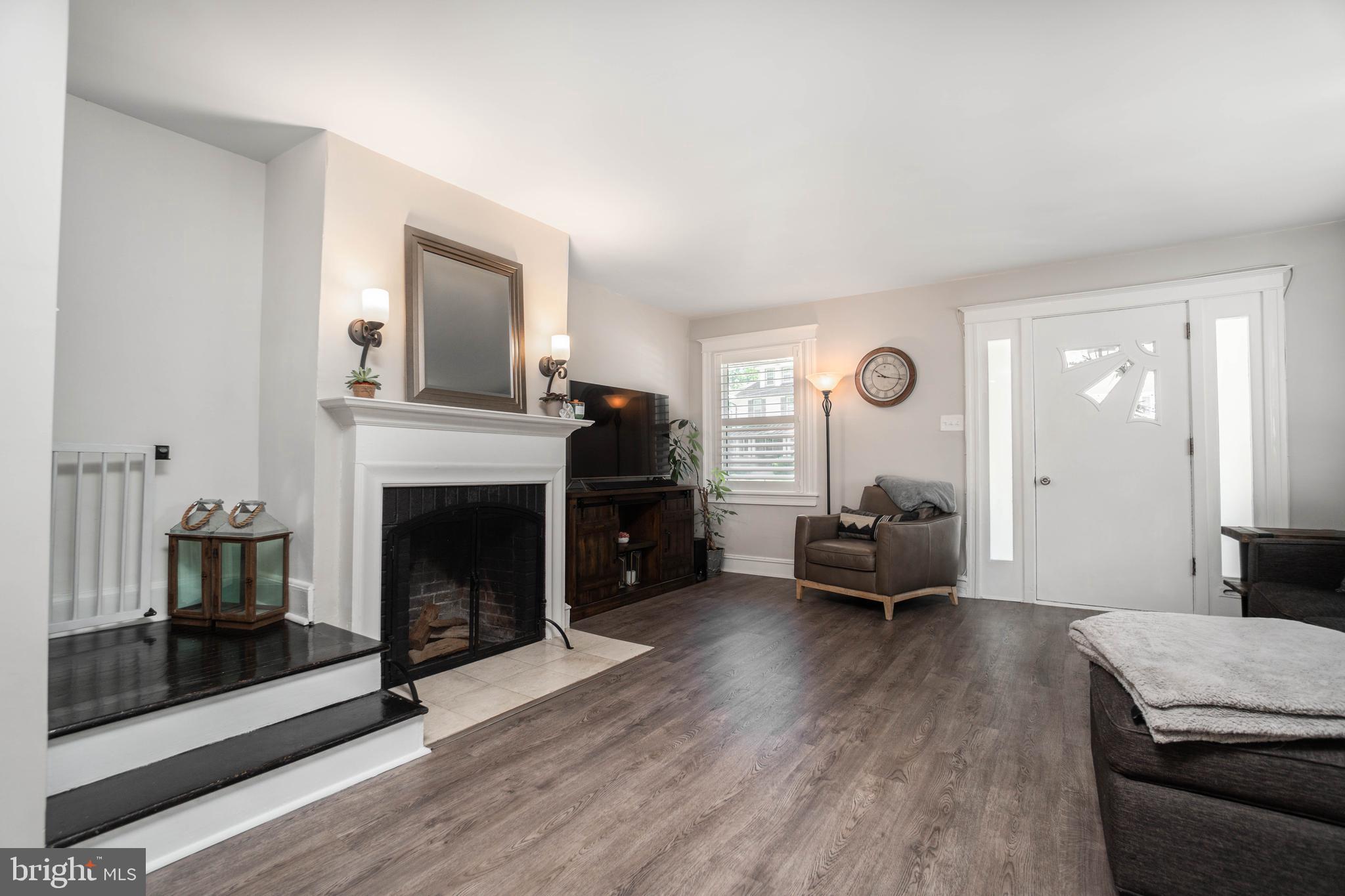 2912 Mapleshade Road Ardmore, PA 19003 - Photo 13 of 46 a living room with furniture and a fireplace