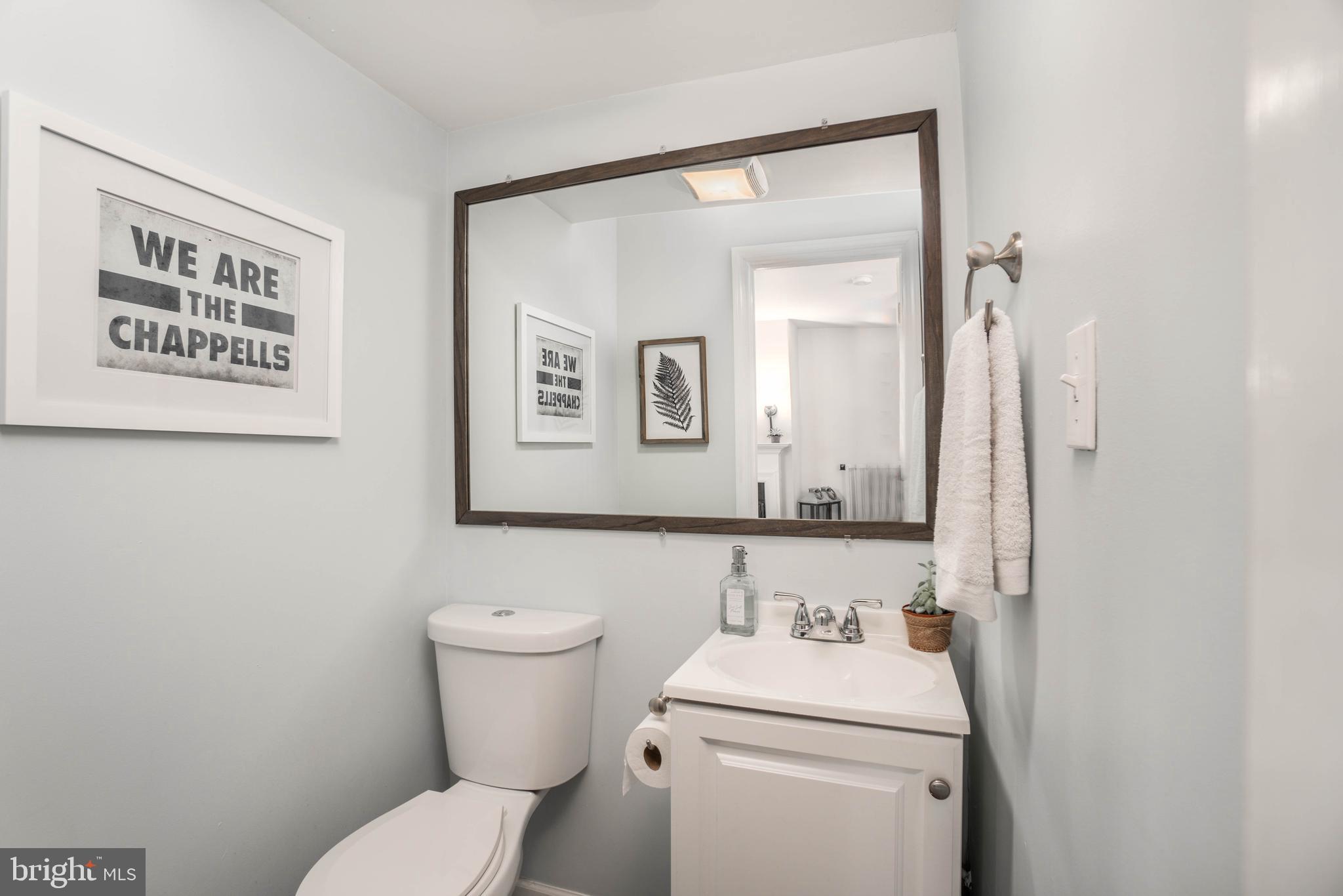 2912 Mapleshade Road Ardmore, PA 19003 - Photo 23 of 46 a bathroom with a toilet sink and mirror