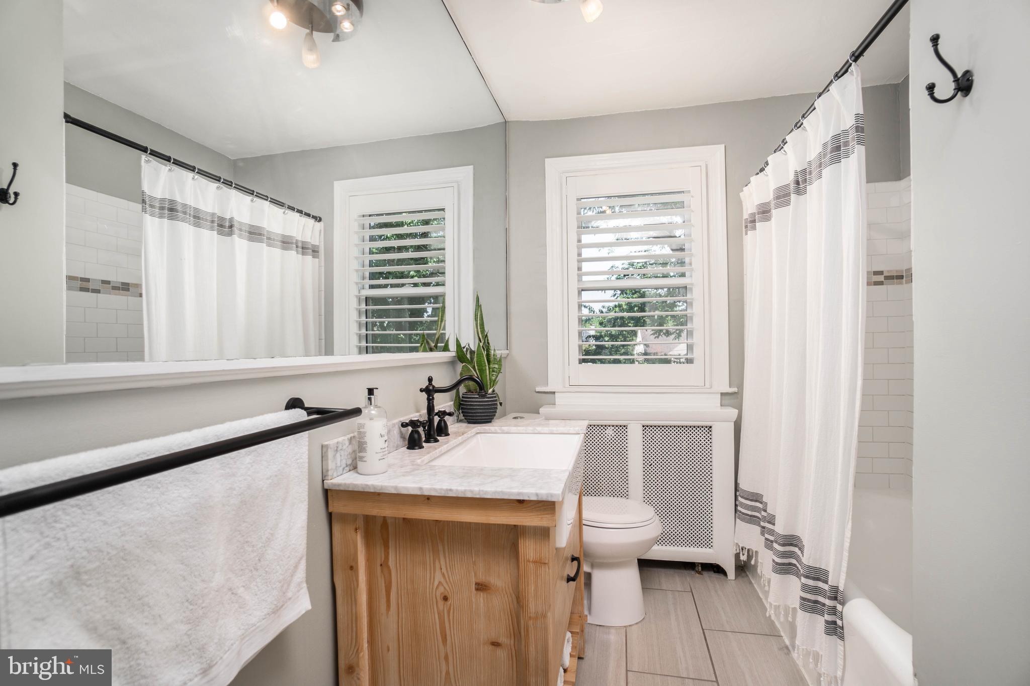 2912 Mapleshade Road Ardmore, PA 19003 - Photo 34 of 46 a bathroom with a sink double vanity and a bathtub