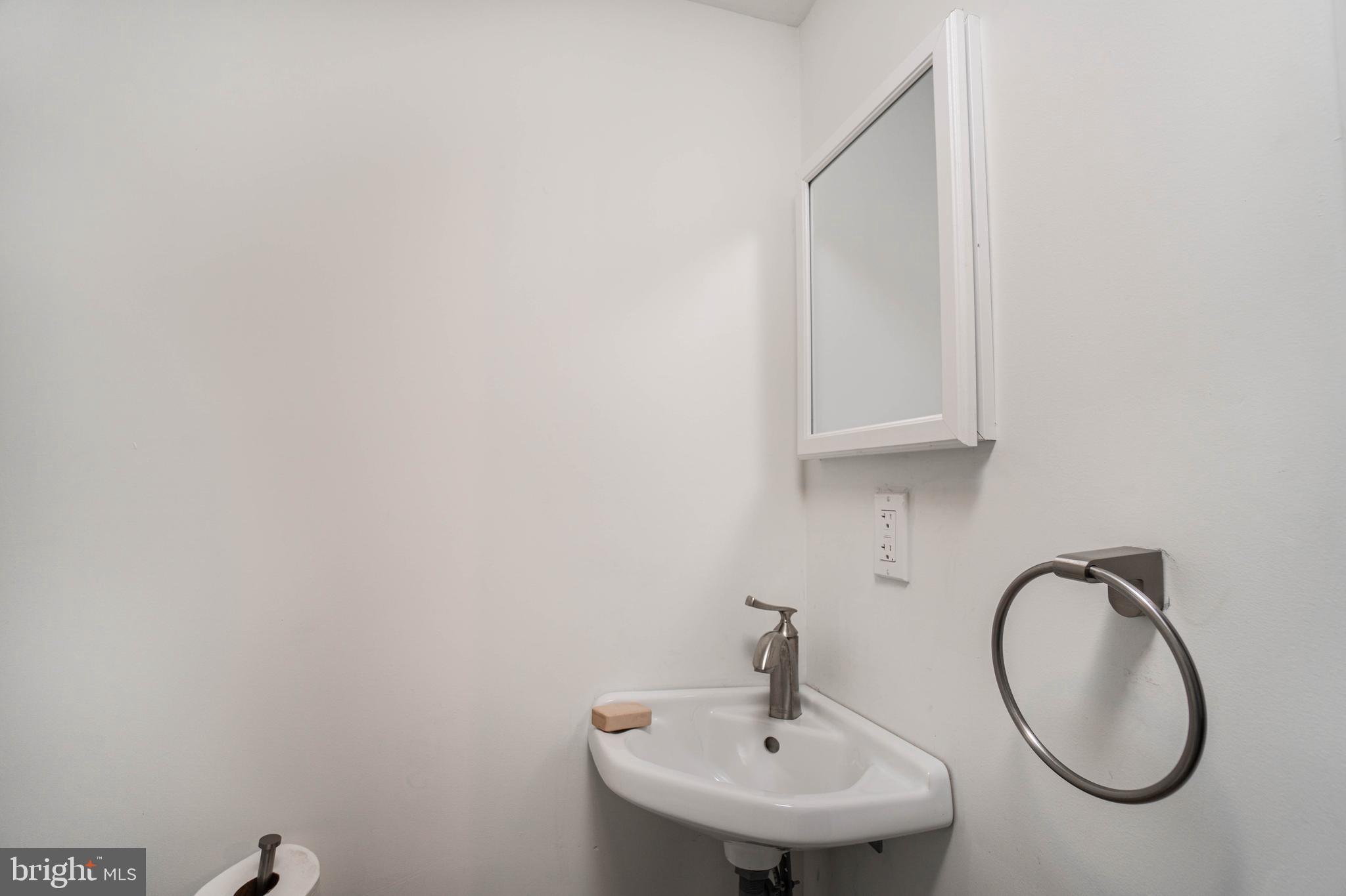 2912 Mapleshade Road Ardmore, PA 19003 - Photo 41 of 46 a bathroom with a sink and a mirror