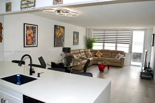 a living room with furniture window and a table