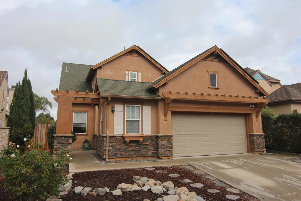 445 Poets Square Fallbrook, CA 92028 - Photo 1 of 37 a front view of a house with garden