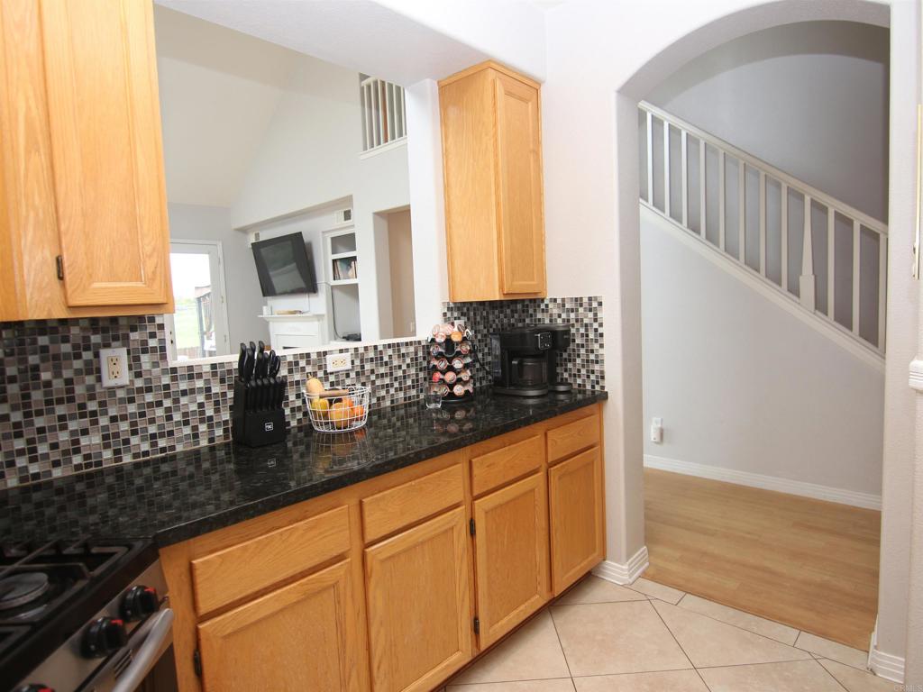 445 Poets Square Fallbrook, CA 92028 - Photo 11 of 37 a kitchen with sink and cabinets