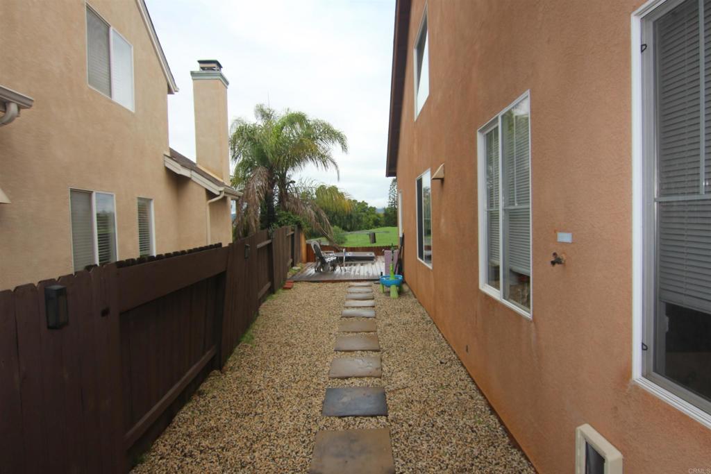 445 Poets Square Fallbrook, CA 92028 - Photo 36 of 37 a view of a porch with wooden floor and stairs
