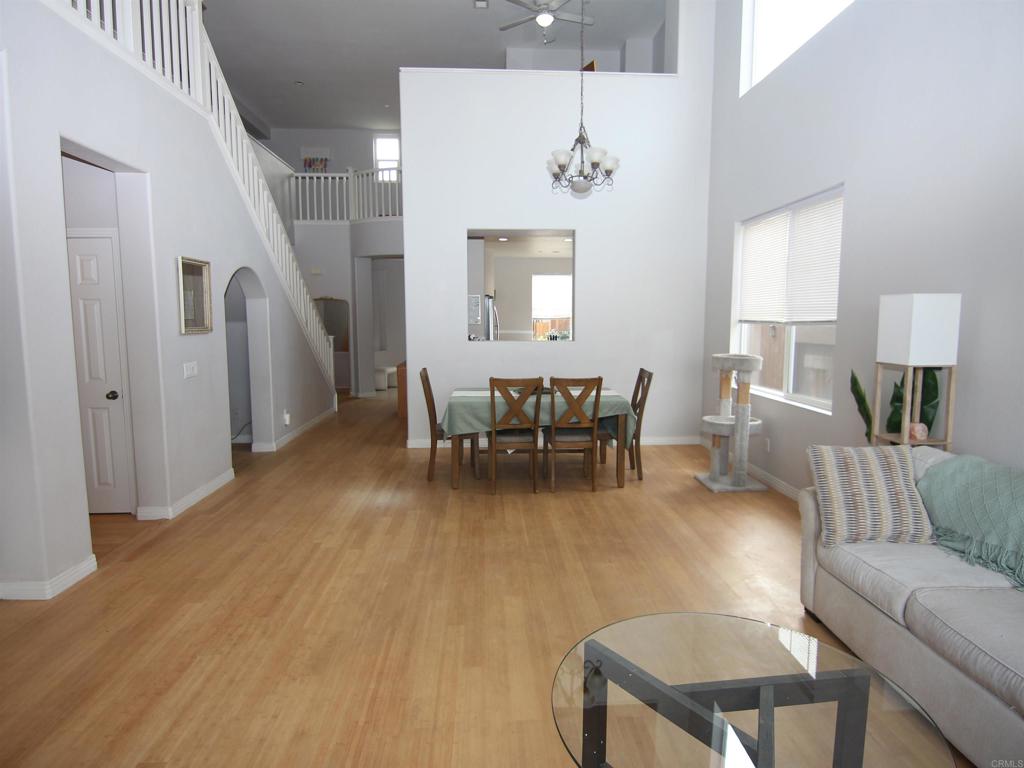 445 Poets Square Fallbrook, CA 92028 - Photo 5 of 37 a living room with furniture and a dining table