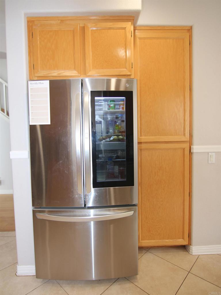 445 Poets Square Fallbrook, CA 92028 - Photo 8 of 37 a view of a refrigerator in kitchen