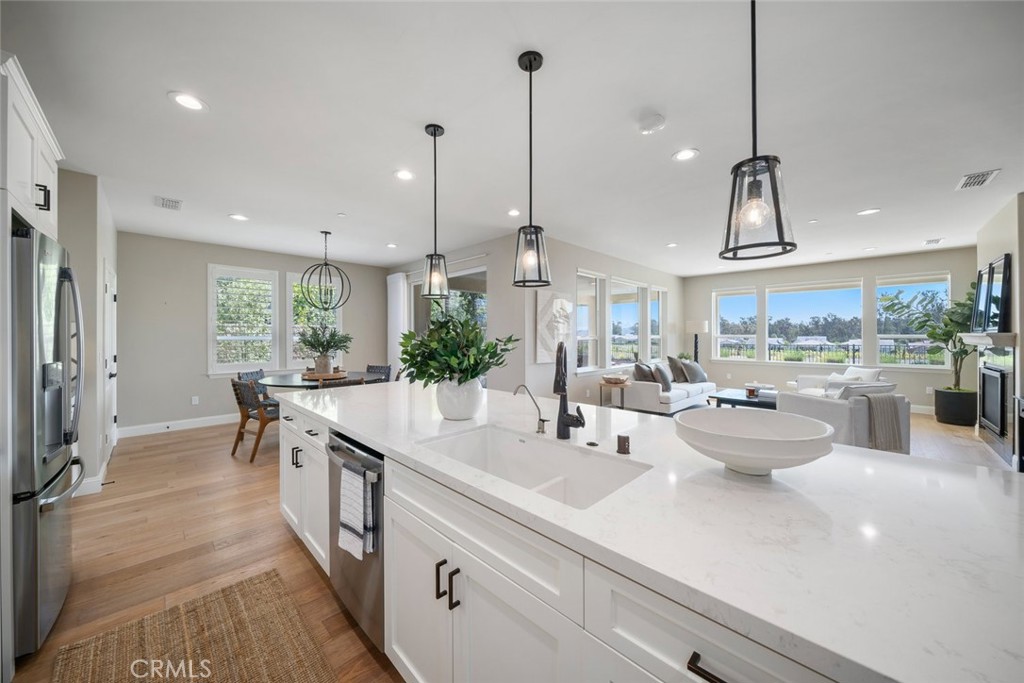 1455 Via Vista Nipomo, CA 93444 - Photo 11 of 34 a kitchen with sink and view of living room