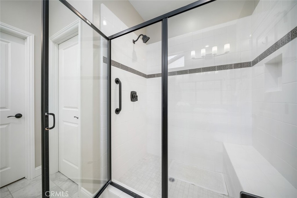 1455 Via Vista Nipomo, CA 93444 - Photo 27 of 34 a bathroom with a glass shower door