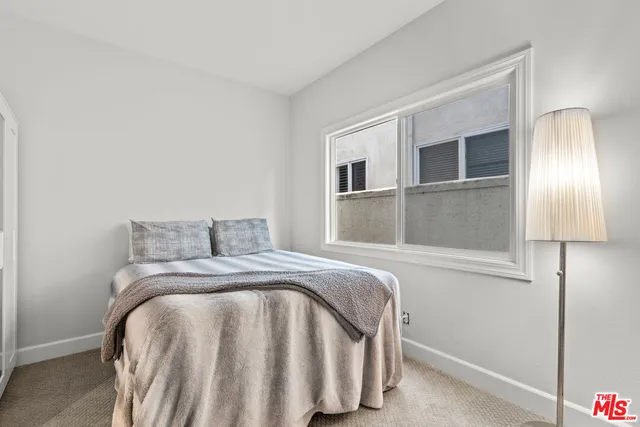 a kitchen with cabinets and white appliances
