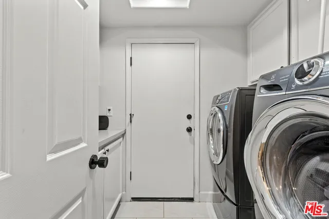 a view of a house with pool and sitting area